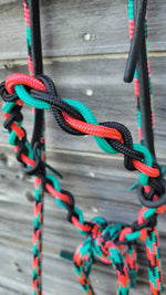 Load image into Gallery viewer, A close-up of a pink, black, and turquoise stiff round training hackamore noseband.
