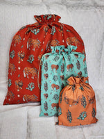 Load image into Gallery viewer, Western Christmas Reusable Gift Bags - Red Ponies Print
