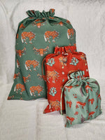 Load image into Gallery viewer, Western Christmas Reusable Gift Bag - Green Longhorns/Ponies
